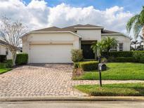 One story home with a two car garage and landscaped yard at 523 Balmoral Dr, Davenport, FL 33896