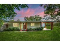 Charming single story home with a manicured lawn and covered entry at 815 Magnolia Dr, Altamonte Springs, FL 32701