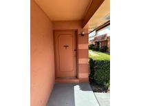 Condo front door entrance with a pathway at 2727 W Oak Ridge Rd # 3, Orlando, FL 32809