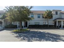 Front view of a townhome with parking at 4845 Romeo Cir, Kissimmee, FL 34746