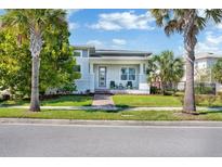 A charming single story home with a welcoming front porch and landscaping at 13010 Stoddart Ave, Orlando, FL 32827