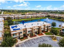 Modern townhouses with solar panels, overlooking a lake at 3169 Pantanal Ln, Kissimmee, FL 34747