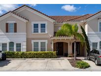 Townhouse exterior with parking and landscaping at 4683 Terrasonesta Dr, Davenport, FL 33837