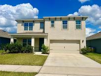 Two-story house with a two-car garage at 1823 Veterans Dr, Kissimmee, FL 34744