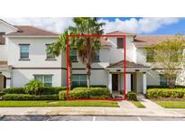 Two-story townhome with landscaping and parking at 8930 Stinger Dr, Davenport, FL 33896