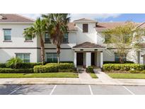 Two-story townhome with landscaping and parking at 8932 Stinger Dr, Davenport, FL 33896
