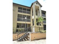 Exterior view of a two-story building with balconies and a stairwell at 623 Dory Ln # 112, Altamonte Springs, FL 32714