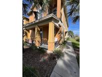 Exterior view of townhome with porch and walkway at 6560 Candied Peel Aly, Winter Garden, FL 34787