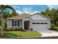 Craftsman style home with gray siding and two-car garage at 4060 Bannock Ave, Tavares, FL 32778