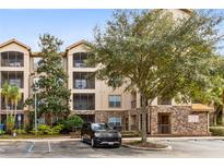 Three-story residential building with balconies and ample parking at 1301 Tuscan Ter # 9106, Davenport, FL 33896