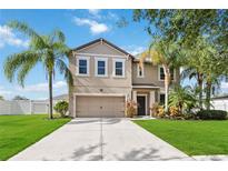 Two-story house with a two-car garage and landscaped lawn at 3804 Marietta Way, St Cloud, FL 34772