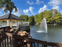 Community features a pond with fountain and gazebo at 5773 Gatlin Ave # 627, Orlando, FL 32822