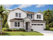 Two-story home with stone accents and landscaping at 3740 Deer Ridge Dr, Mount Dora, FL 32757