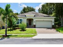 One-story house with a two-car garage and well-maintained lawn at 468 Andalusia Loop, Davenport, FL 33837