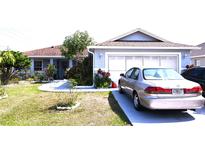 Landscaped front yard with curb appeal at 101 Whitehall Way, Kissimmee, FL 34758