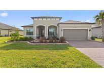 One-story home with a two-car garage and well-manicured lawn at 972 Ladera Ranch Rd, Kissimmee, FL 34759