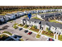 Aerial view of townhome community, highlighting a specific unit and its location at 4297 Paragraph Dr, Kissimmee, FL 34746