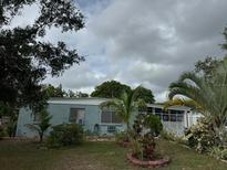 Ranch style home with mature landscaping and a spacious yard at 116 S 4Th St, Haines City, FL 33844