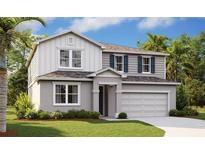 Two-story house with gray siding, white accents, and a two-car garage at 1698 Sugarbelle Cir, Mascotte, FL 34753