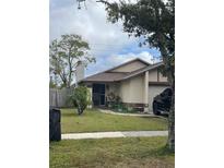 One-story house with a yard and driveway, offering curb appeal at 425 Blue Jacket Ln, Orlando, FL 32825