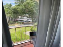Balcony with a view of the community and trees at 508 Orange Dr # 20, Altamonte Springs, FL 32701