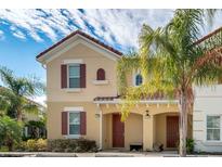 Two-story townhome with attractive facade and landscaping at 4735 Terrasonesta Dr, Davenport, FL 33837