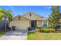 Attractive one-story house with a two-car garage and well-maintained landscaping at 1940 Banner Ln, Saint Cloud, FL 34769