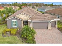 Beautiful home with tile roof and landscaped yard at 681 San Joaquin Rd, Poinciana, FL 34759