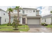 Two-story home with attached garage and landscaping at 3850 Oakville Ave, Kissimmee, FL 34741
