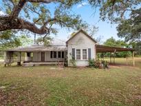 Older home with carport and large yard at 6106 Pine Nw Ave, Lakeland, FL 33810