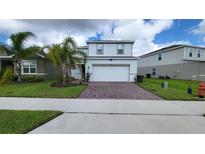 Two story home with brick paver driveway at 1564 Eucalyptus Way, Davenport, FL 33837