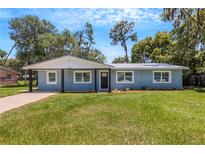 Newly renovated light blue home with a large yard at 3419 Lisa Ln, Lakeland, FL 33801