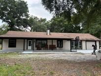 Ranch style home with covered porch and large backyard at 10566 Cr 671, Bushnell, FL 33513