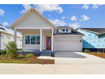 One-story home with white siding and a red door at 3062 Bootlace Way, Saint Cloud, FL 34771