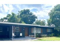 Ranch home with dark exterior and carport at 118 5Th Jpv St, Winter Haven, FL 33880