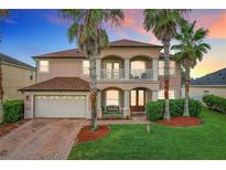 Two story home with brick pavers and palm trees at 924 Timber Isle Dr, Orlando, FL 32828