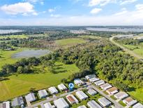 Aerial view showing home location and surrounding area at 6505 Raintree Ne Ln, Winter Haven, FL 33881