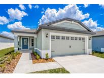 Curb appeal abounds in this charming one-story home featuring a two-car garage and well-manicured landscaping at 3816 Corsican Pl, Lake Alfred, FL 33850