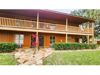 Two-story building with balconies and landscaping at 3200 River Ranch Blvd # 160, River Ranch, FL 33867