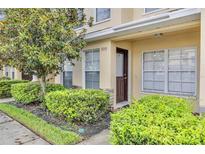 Townhouse exterior with well-maintained landscaping at 5333 River Rock Rd, Lakeland, FL 33809