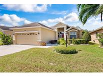Front view of house, yard, and driveway at 6269 Silver Leaf Ln, Lakeland, FL 33813