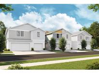 New construction townhouses with attached garages at 4317 Hillock Blvd, Haines City, FL 33844