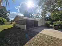 Home's exterior features a screened porch at 3414 Portersfield Rd, Orlando, FL 32808