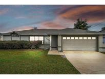 Charming one-story home with a two-car garage at 3024 Foxboro Cir, Deltona, FL 32738