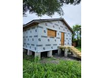 New house under construction, exterior wrap, steps, and small deck at 2330 Greenway, Sanford, FL 32771