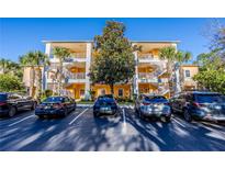 Three-story building with multiple units and parking at 308 New Providence # 308, Davenport, FL 33897