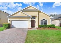 Charming one-story house with a two-car garage at 163 Andalusia Loop, Davenport, FL 33837