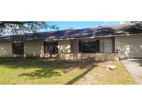 Ranch-style home with a well-maintained lawn and attached garage at 2117 High Point Sw Ave, Winter Haven, FL 33880