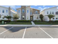 Two-story modern home with stone accents and landscaping at 4550 Narrative Ln, Kissimmee, FL 34746