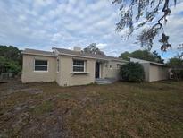 Charming single story home with a well-maintained lawn at 1124 Sunshine Ave, Leesburg, FL 34748